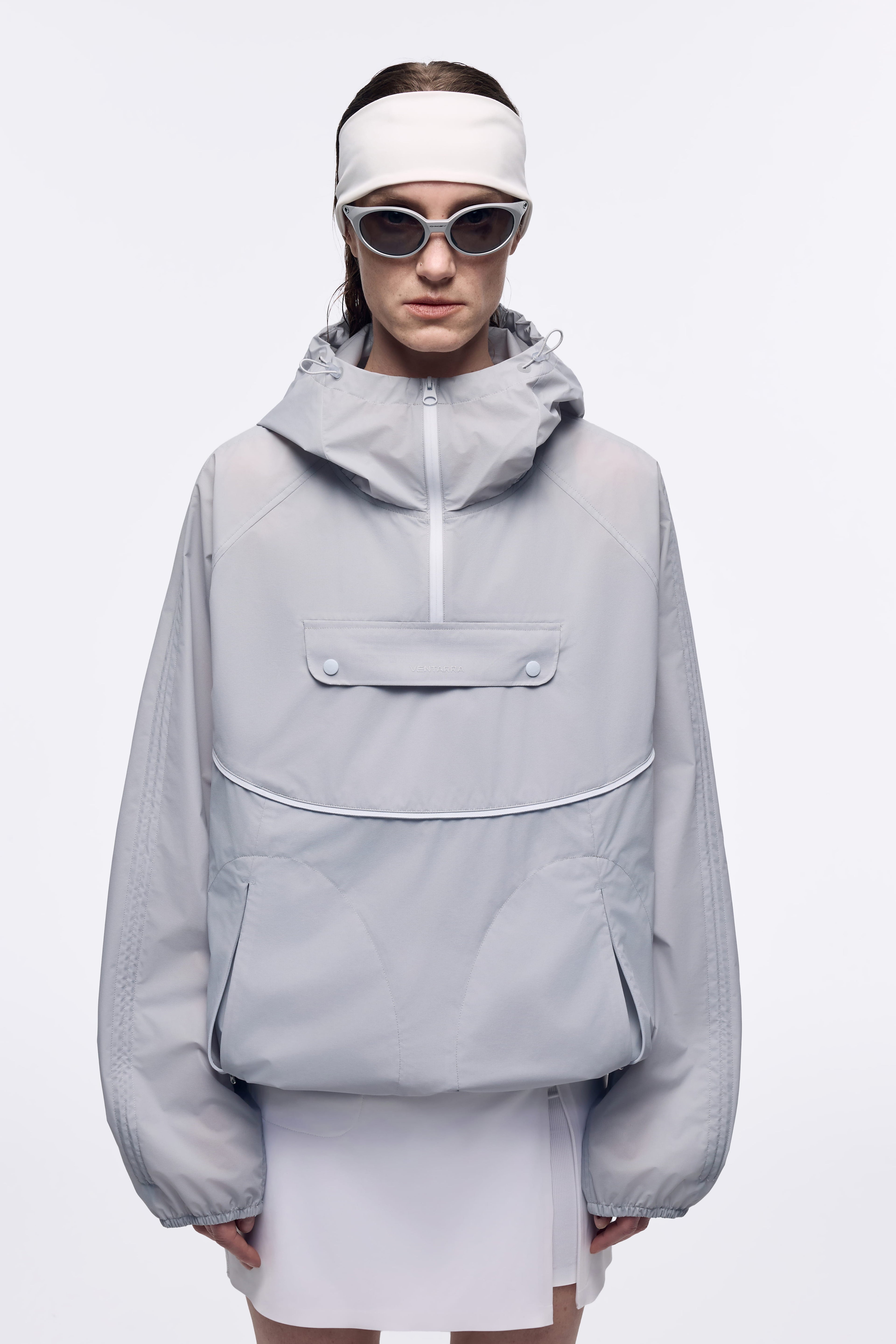 VENTARRA lightweight waterproof trail running jacket worn by a model, featuring breathable fabric and windproof protection for outdoor activities