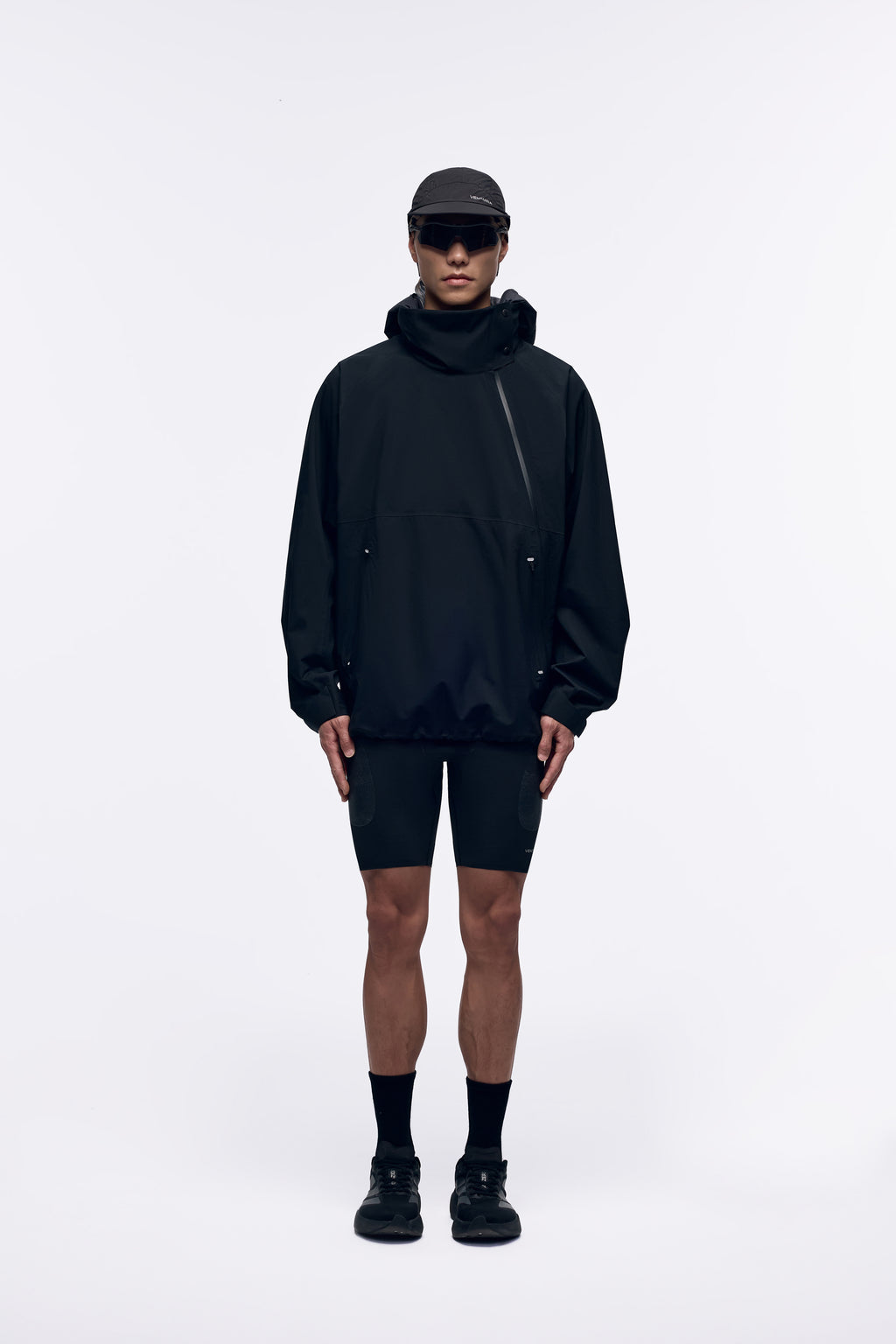 Ventarra unisex bonded jacket in Stone Black — front view, seam-sealed windbreaker with hidden hood and diagonal zipper
