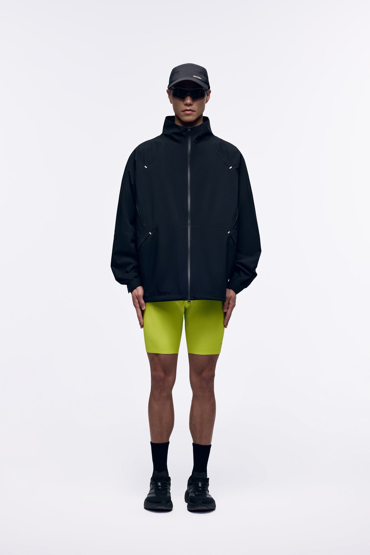 Ventarra unisex bonded shell jacket in Black — front view, hoodless waterproof windbreaker with fully taped seams and clean minimal silhouette
