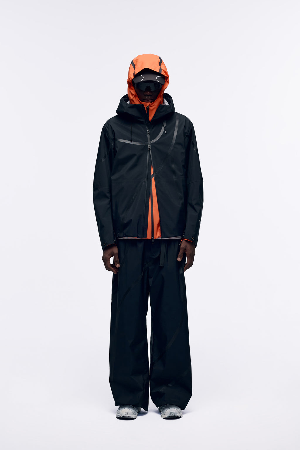Ventarra unisex hooded shell jacket in Black — waterproof 3-layer composite with asymmetric external tape strips and adjustable hood