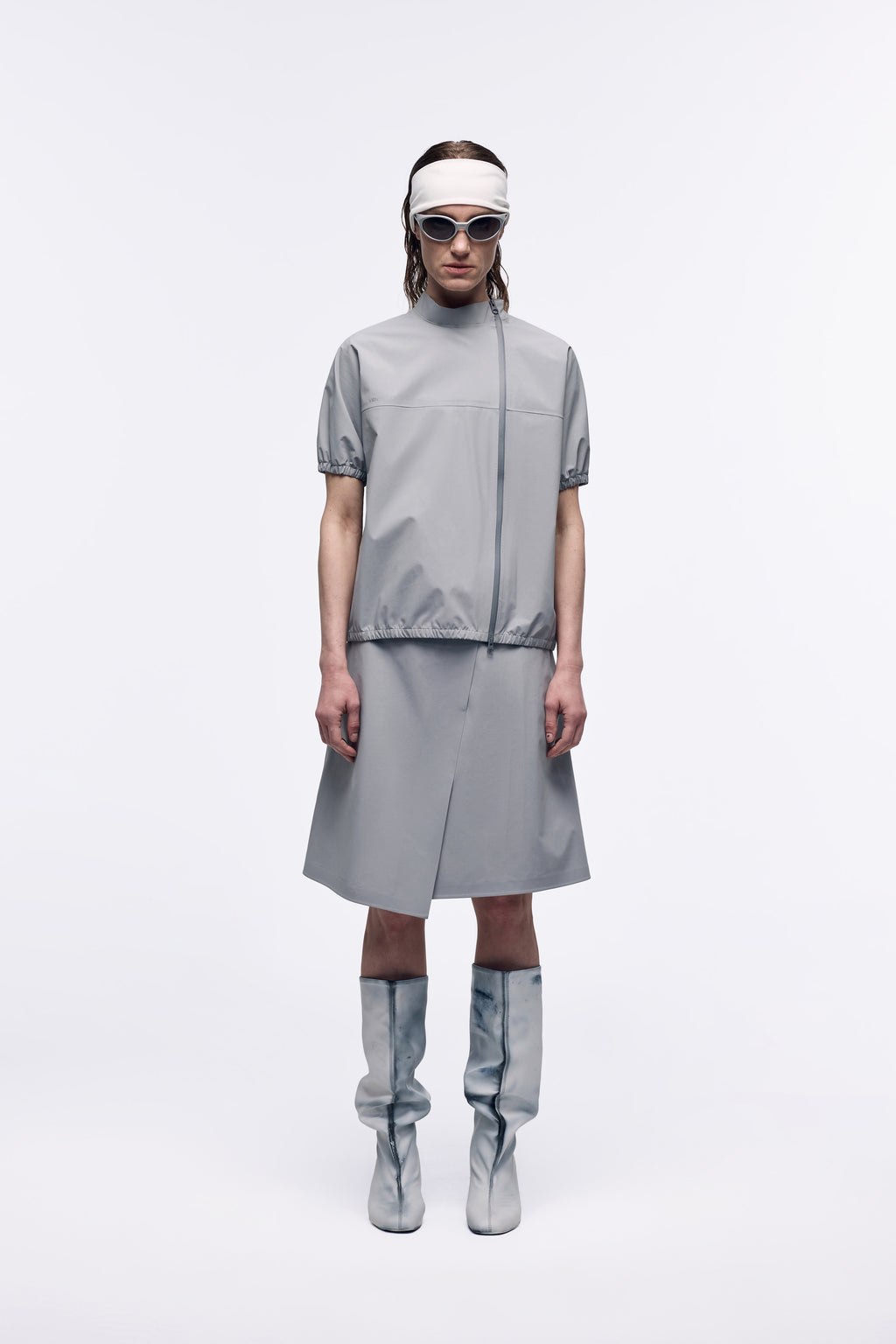 Ventarra women's bonded short-sleeve T-shirt in gray — front view, windproof laminated fabric with two-way zipper, styled with matching skirt and boots
