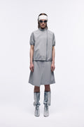 Ventarra women's bonded short-sleeve T-shirt in gray — front view, windproof laminated fabric with two-way zipper, styled with matching skirt and boots
